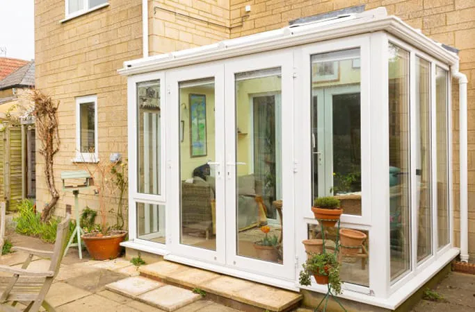 White Everest conservatory with glass doors and windows