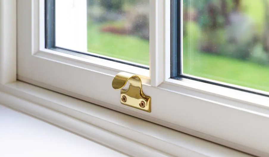 White Everest conservatory window with gold handle