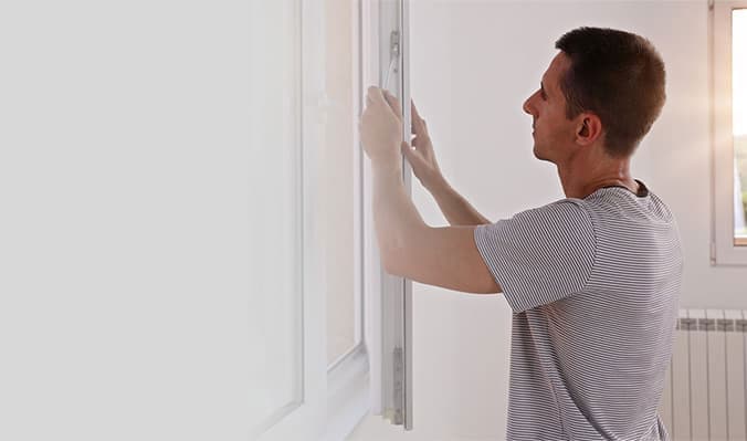Person installing an Everest window