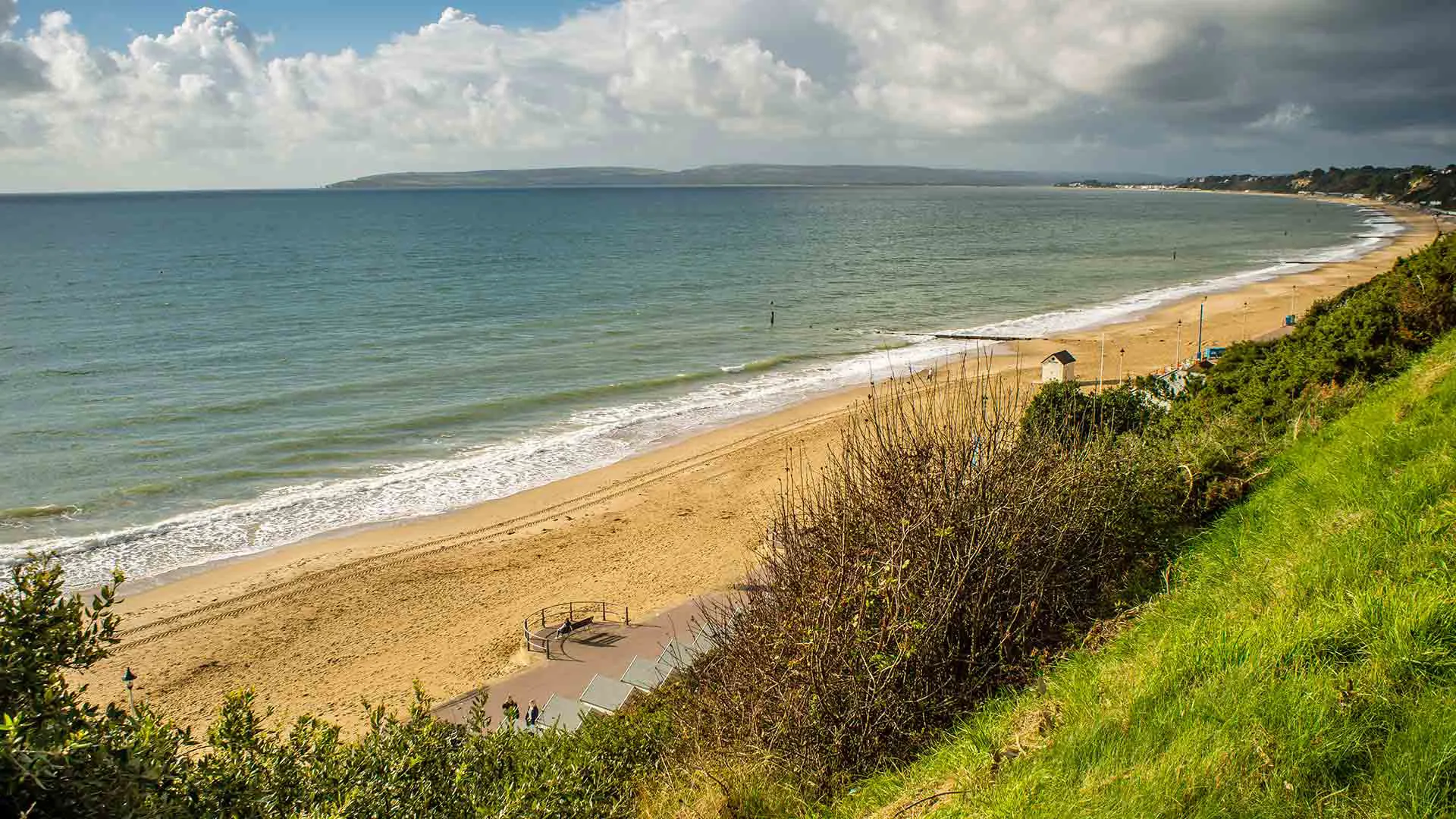 Coastal beach scene with sandy shore and ocean waves