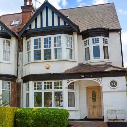 White bay windows on a traditional house