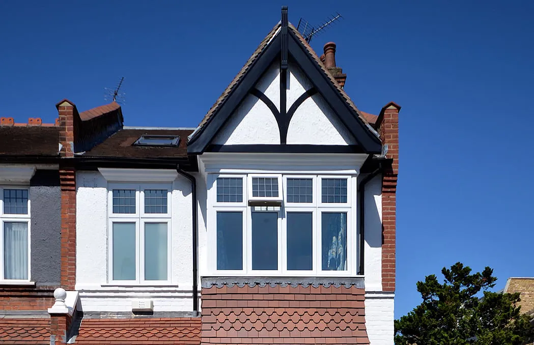 White house with ornately framed bay window