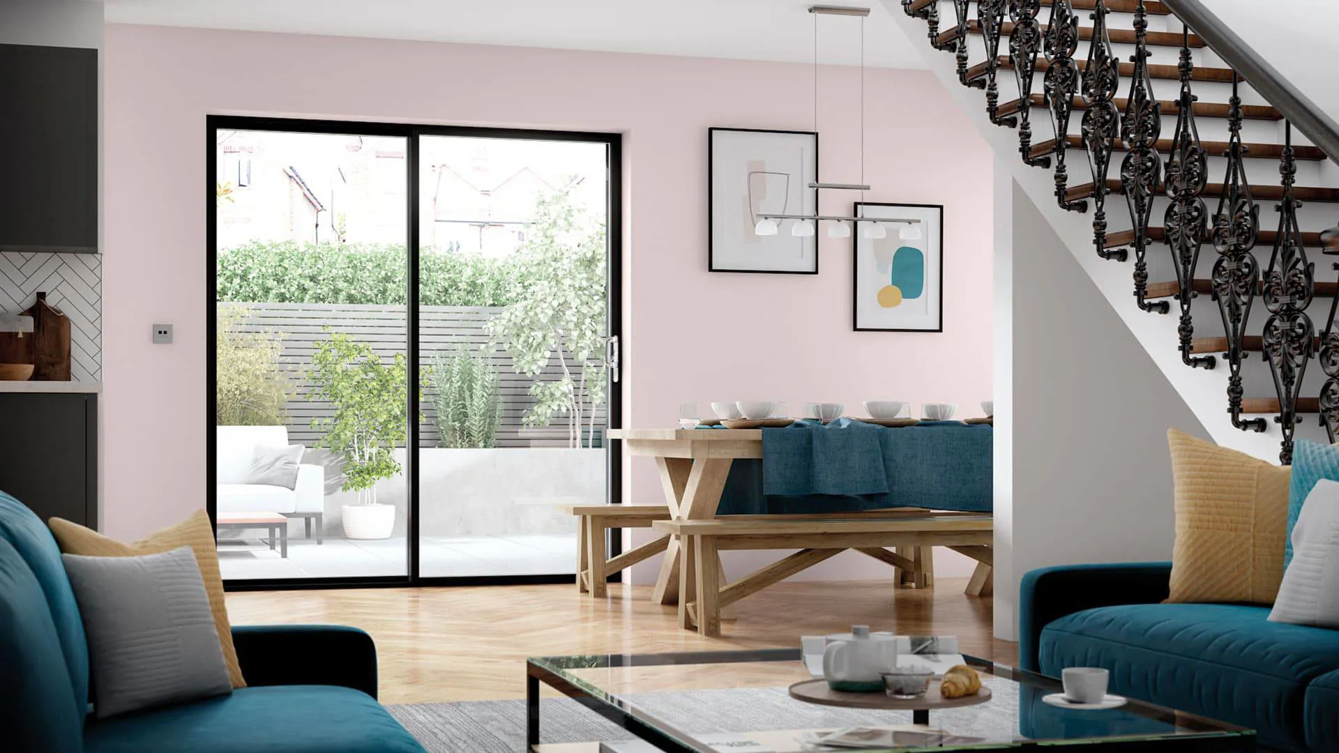 Pink walls open plan dining area with garden view