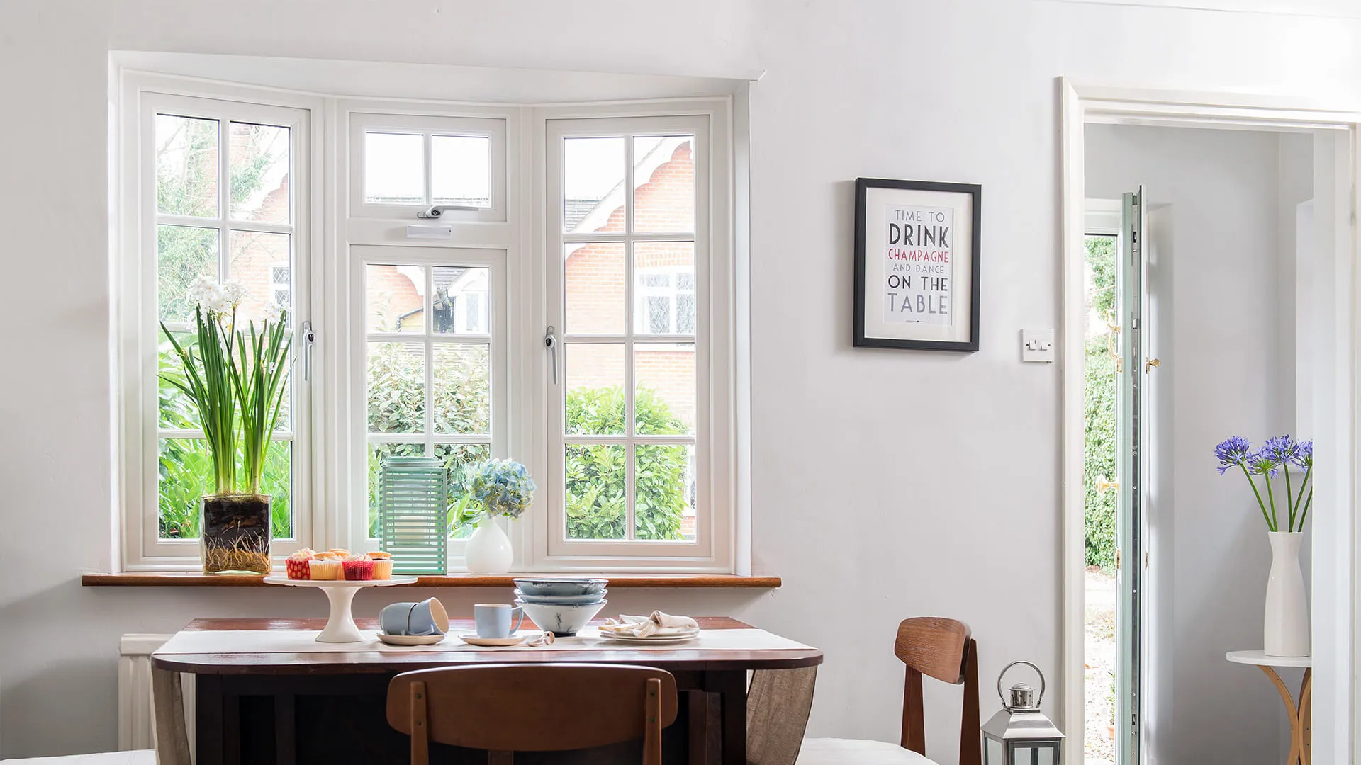 White Everest conservatory window with plants and a view
