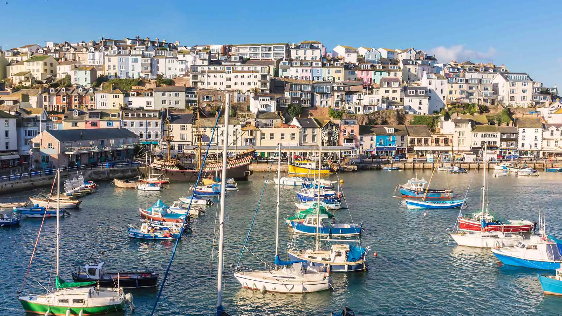 Colorful harbor with boats and buildings