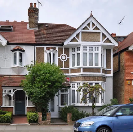 Traditional house with decorative features and white trim
