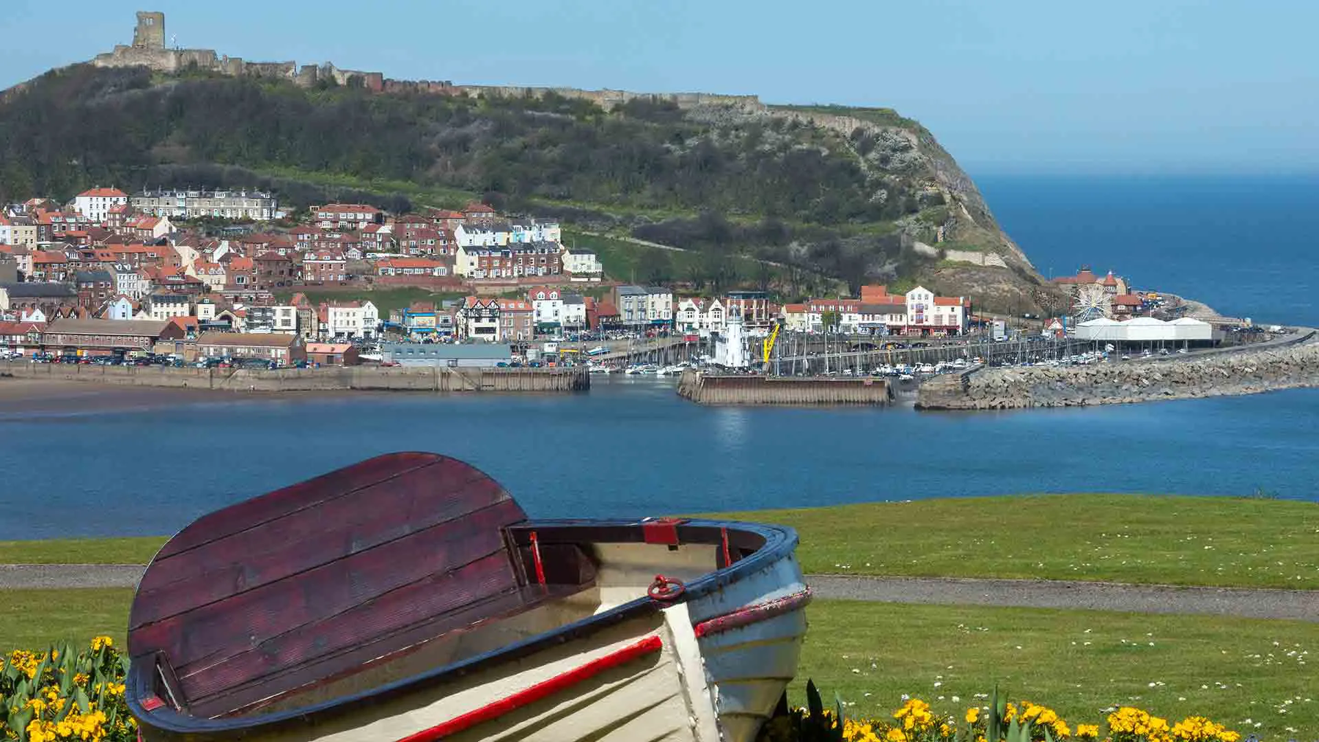 View of coastal town with harbour and boats