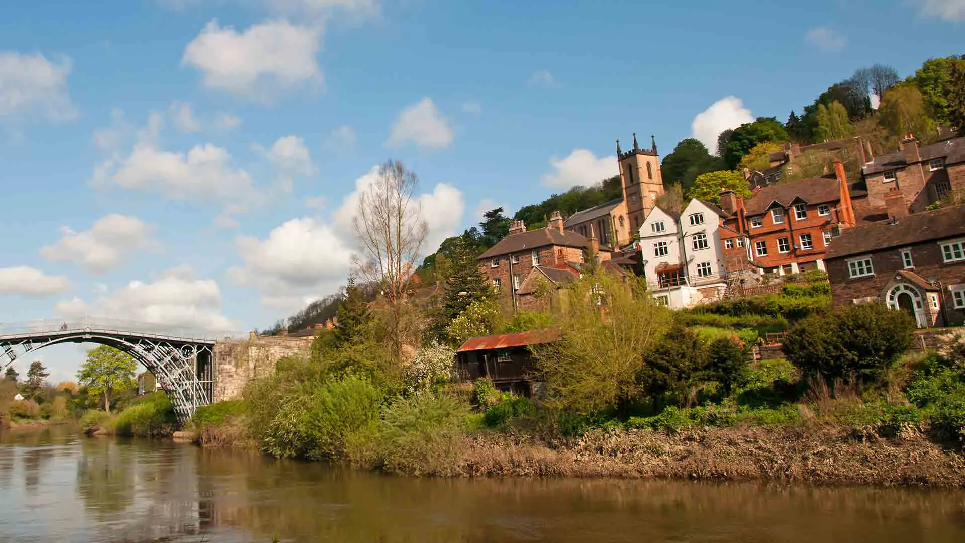 River scene with historic buildings and bridge