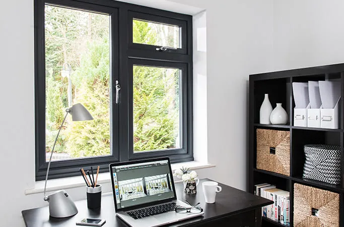 Black Everest window with laptop and desk accessories