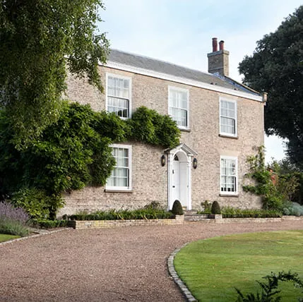 Stone house with white door and windows