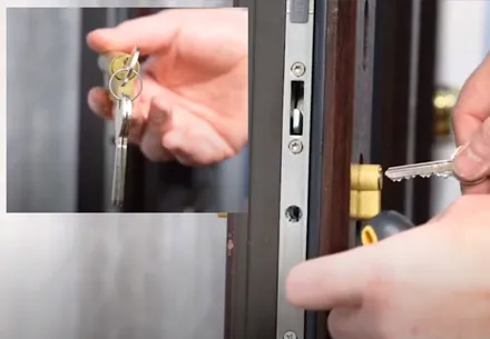 Hands inserting key into Everest conservatory door lock
