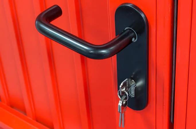 Black door handle on red Everest door with keys