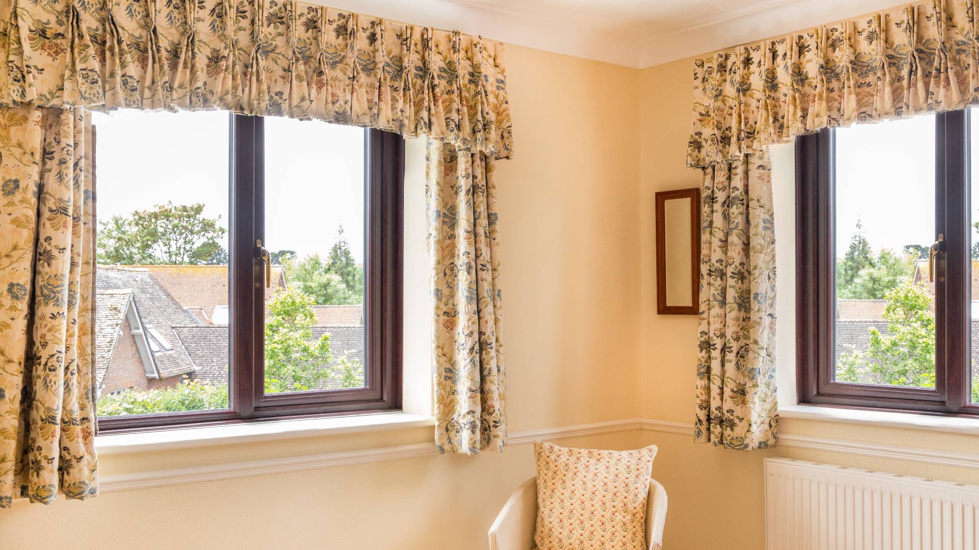 Floral patterned curtains a window view