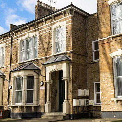 Terraced house entrance with ornate features