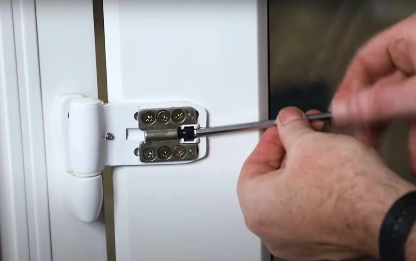 Person using screwdriver on Everest conservatory hinges