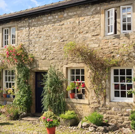 Stone building with many windows and flowers