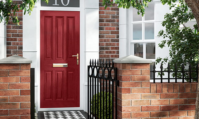 Red door with brick exterior