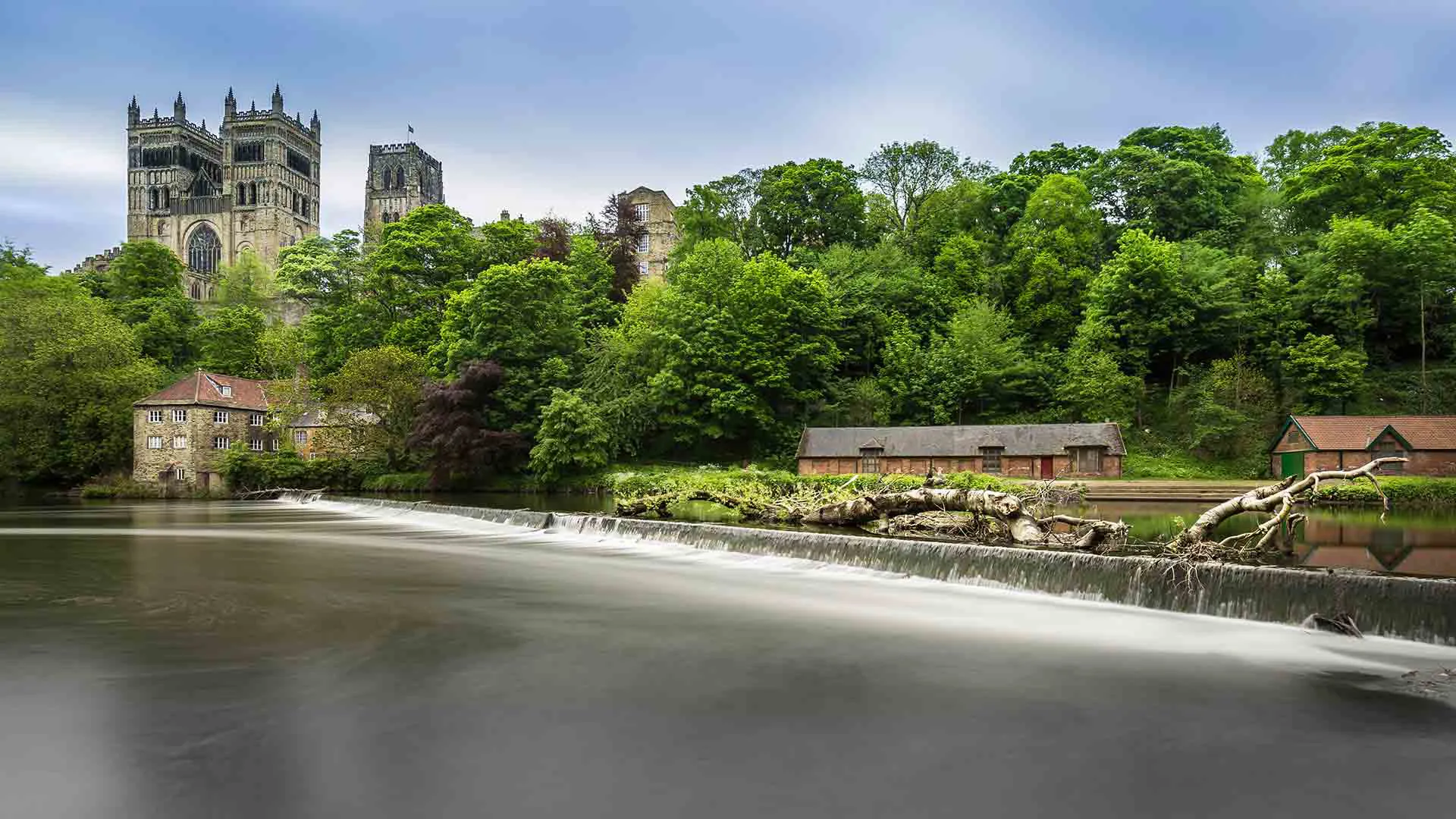 River scene with buildings and trees