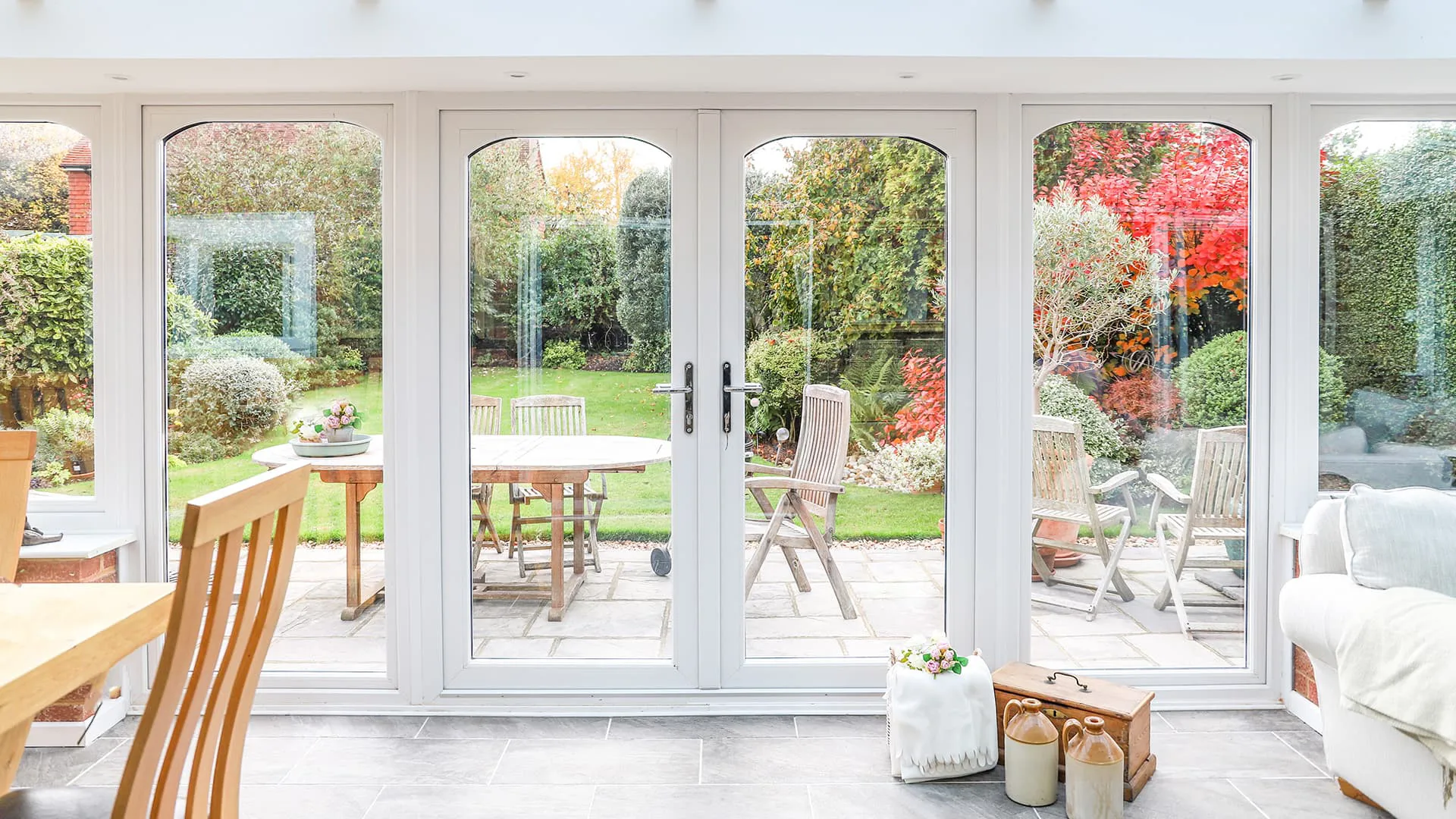 Everest conservatory white double doors garden view
