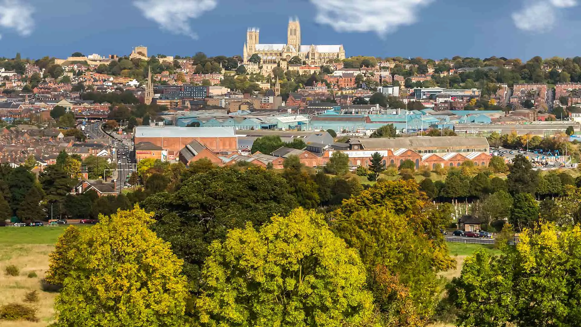 Cityscape view with cathedral and autumn trees