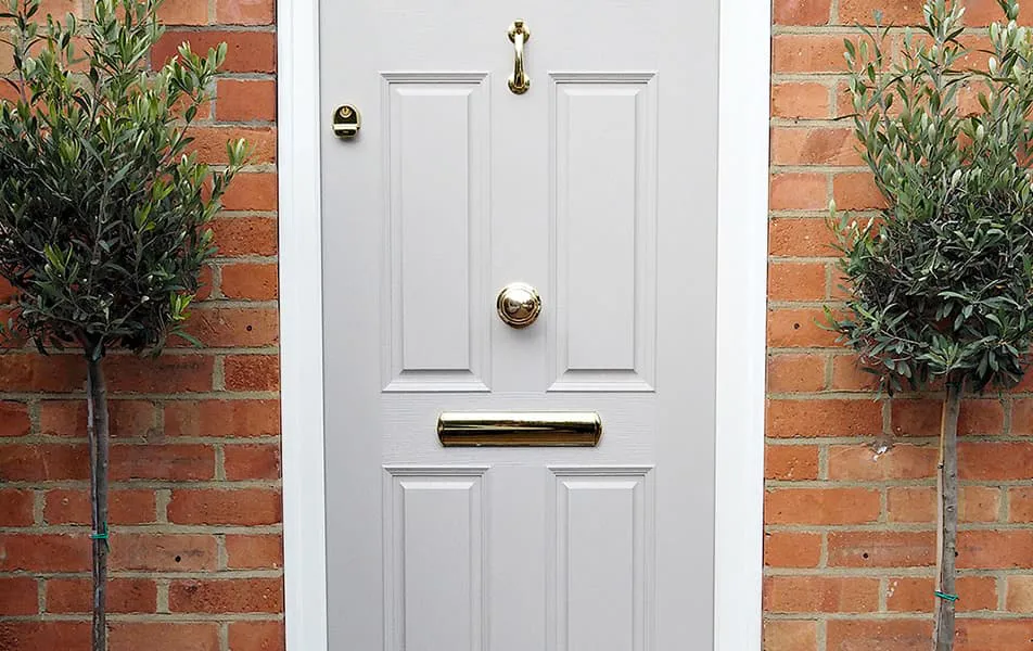 Light gray Everest door with gold hardware and trim