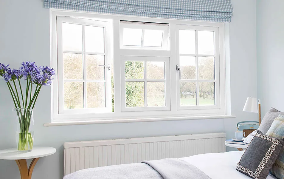 White Everest conservatory window with light blue patterned blinds
