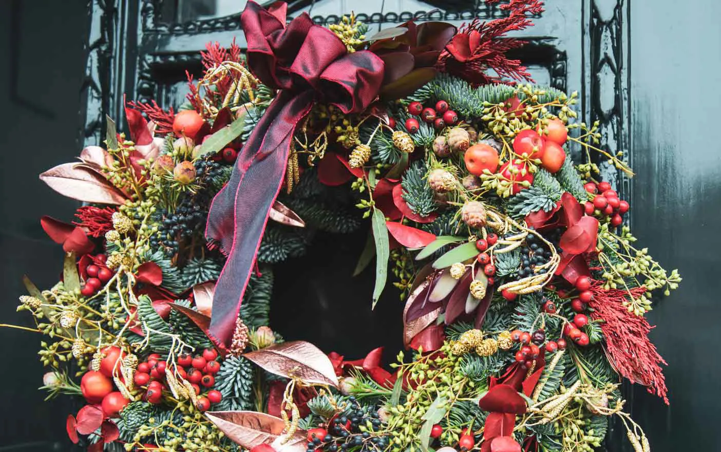 Christmas wreath with red, gold, and green accents