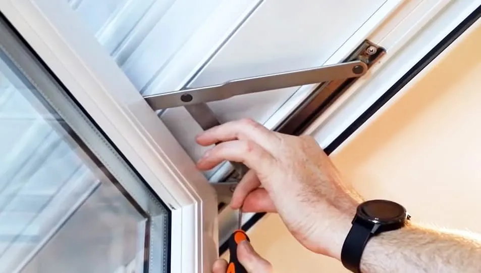 Person adjusting an Everest conservatory window