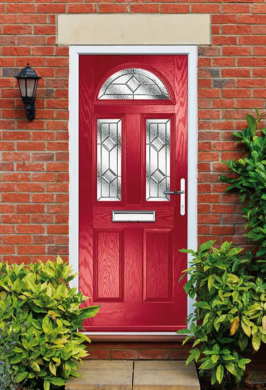 Red door with decorative glass panels