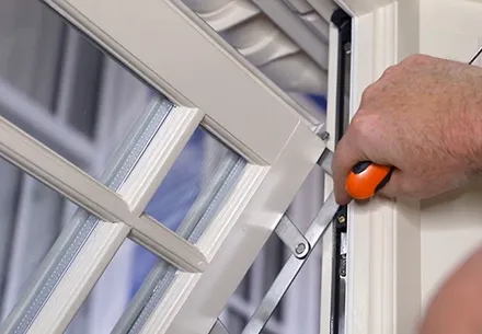 Everest conservatory window being adjusted with orange tool