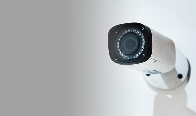 White security camera mounted on wall