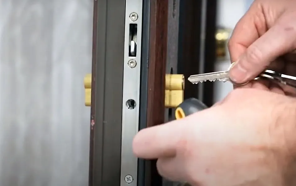 Hand inserting key into Everest door lock