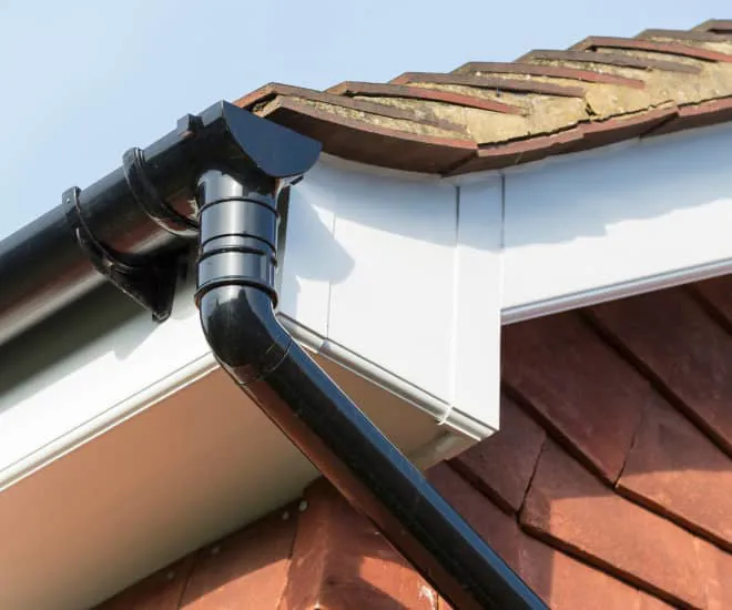 Black conservatory gutter on a white fascia board