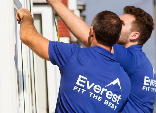 Everest installers measuring for a conservatory installation