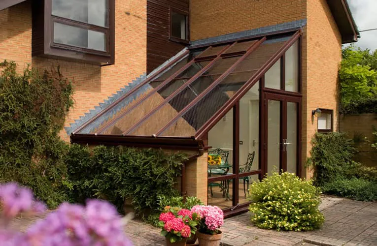 Everest conservatory with brown frame and glass roof