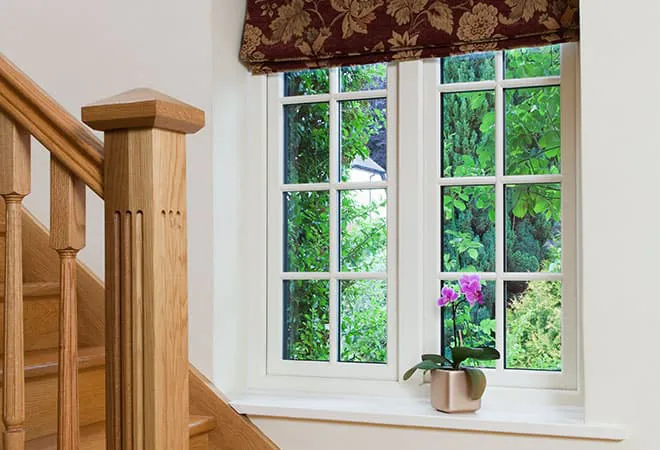 White Everest conservatory window with wooden staircase