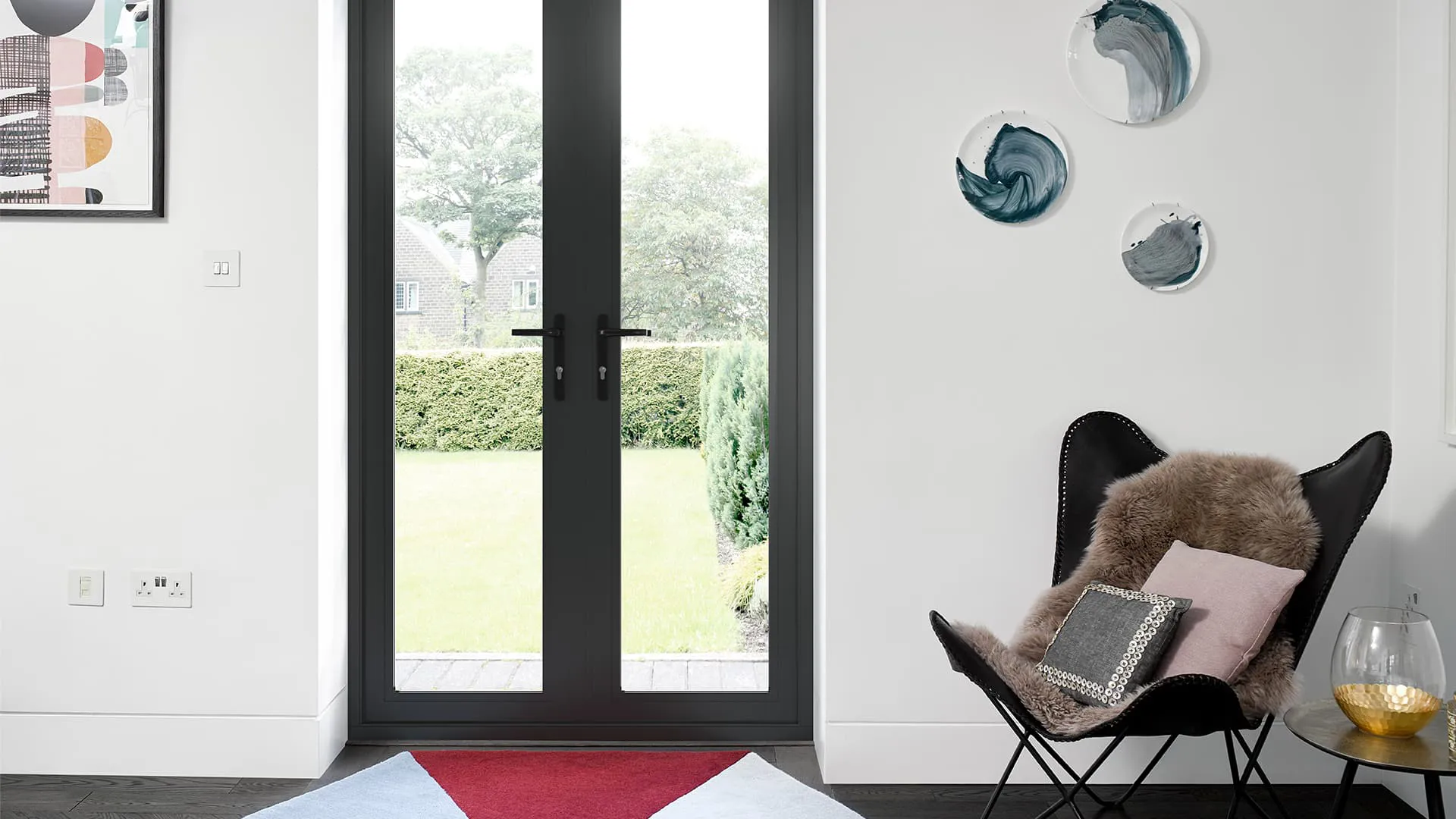 Black framed Everest conservatory doors with garden view