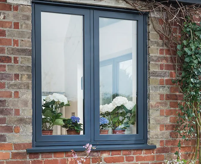 Grey Everest window with plants inside