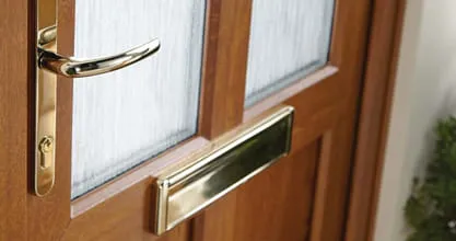 Wooden Everest door with gold handles and letterbox