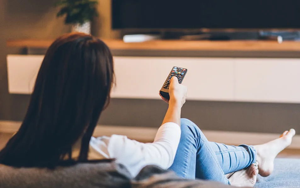 Person using tv remote