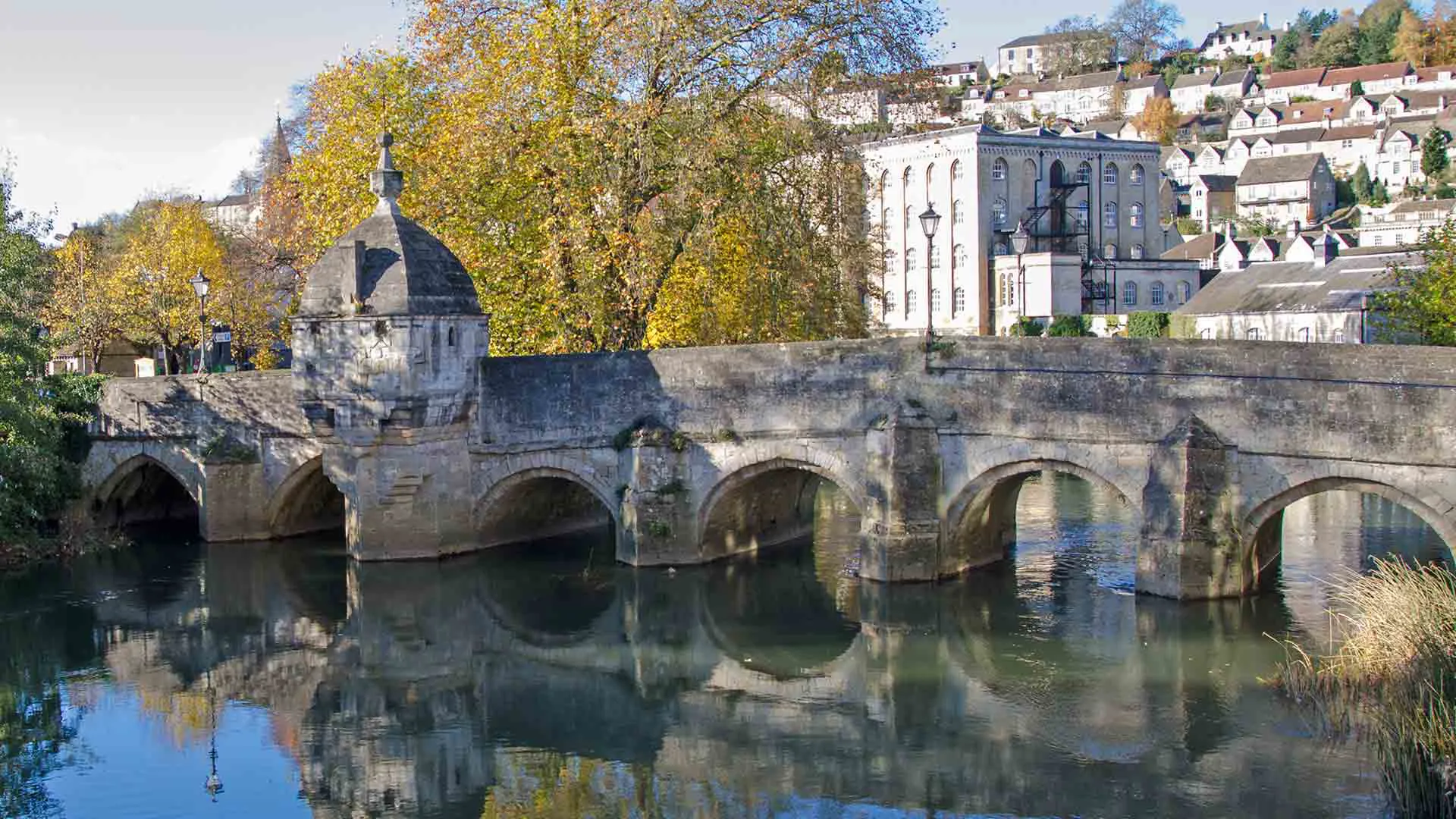 Stone bridge over river with arched openings