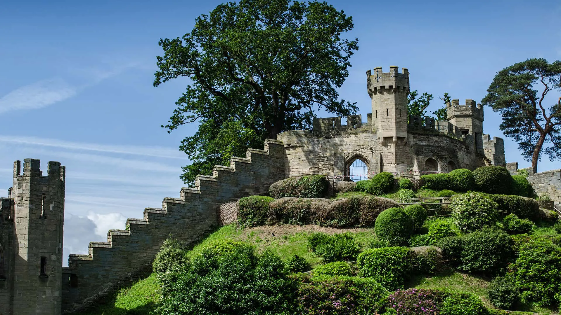 Stone castle walls and gardens