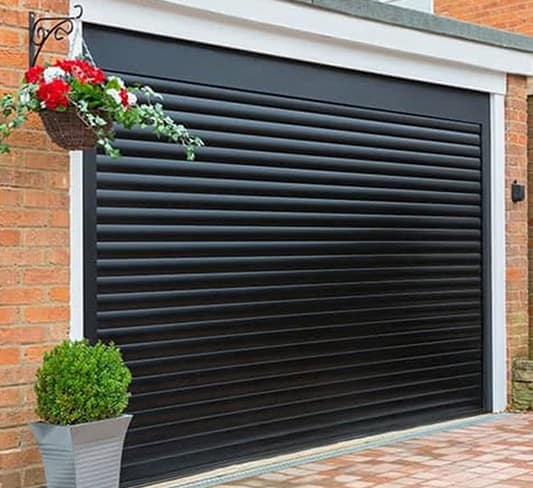 Black ribbed garage door on a house