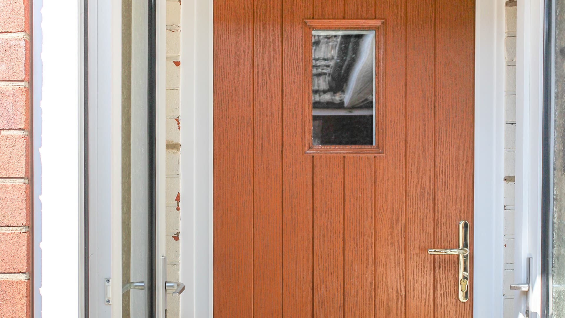 Everest conservatory door with a light orange wood grain finish