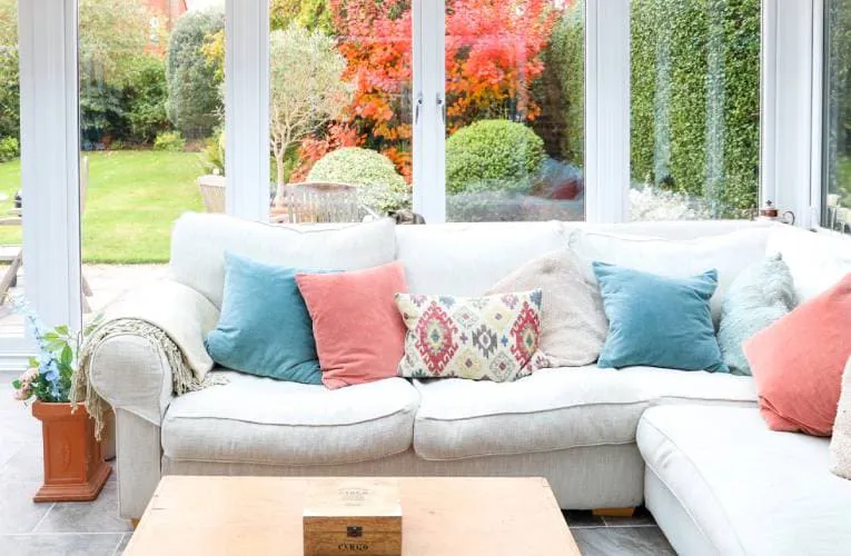 Everest conservatory with white sofa and colorful cushions