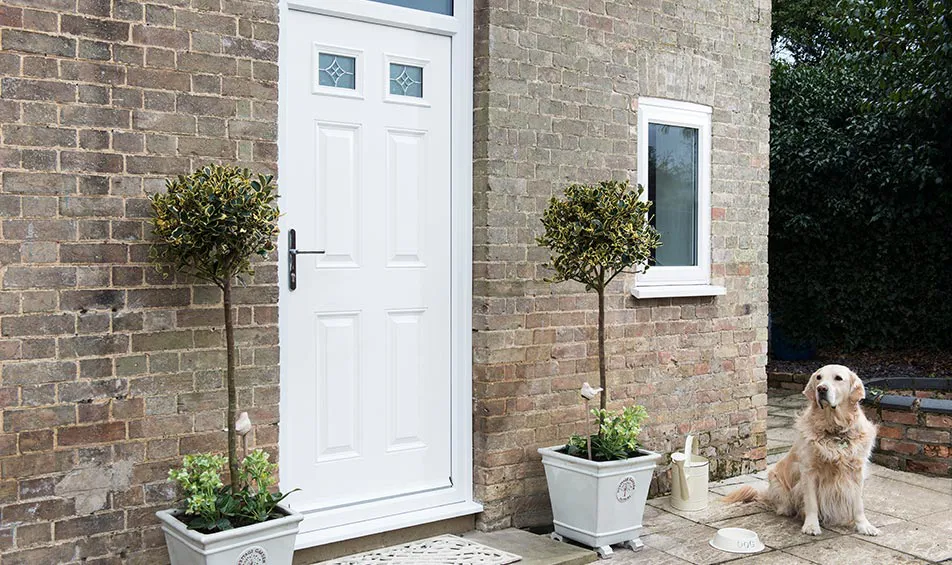 White Everest conservatory door with brick exterior