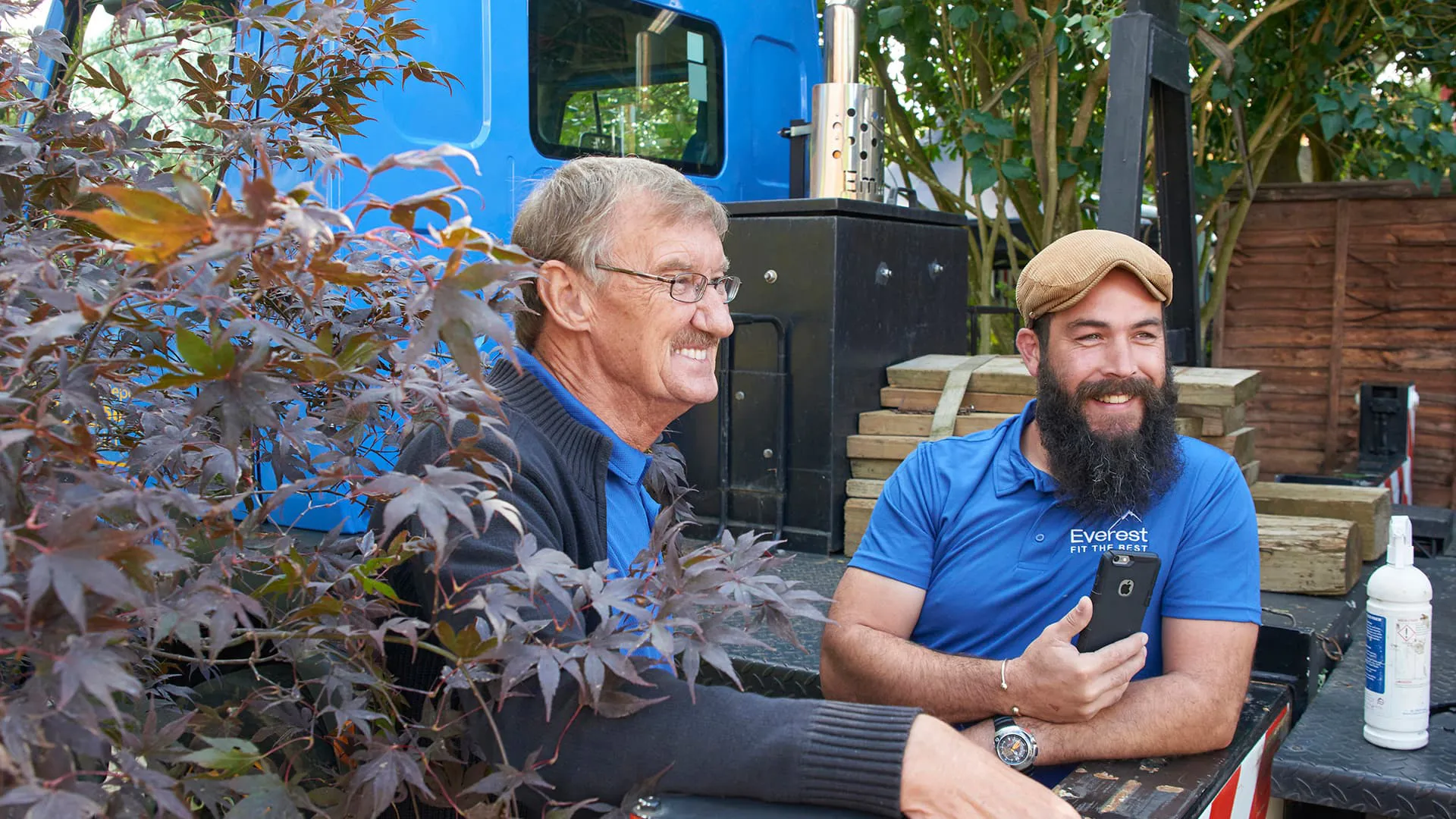 Two Everest employees smiling outdoors