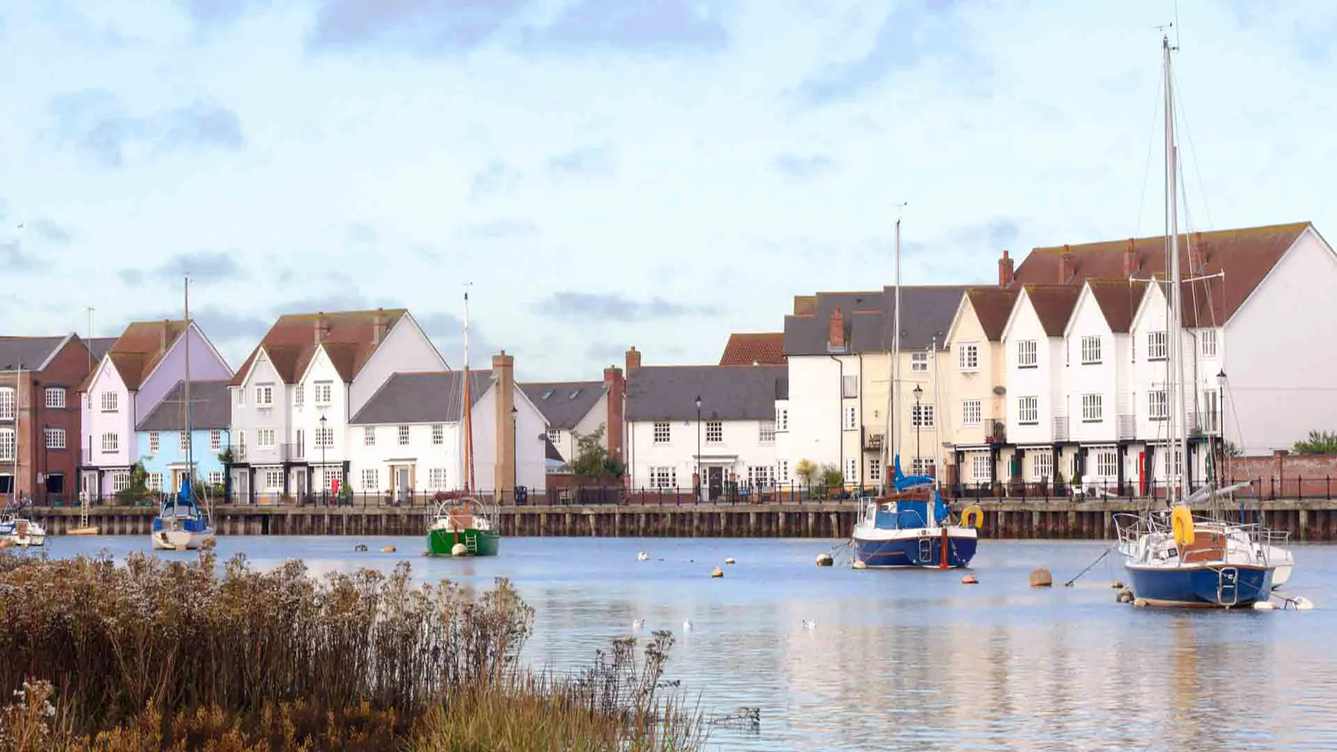 Colorful houses waterfront with boats