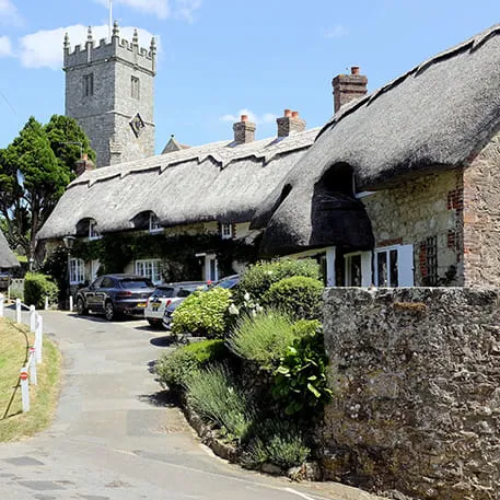 Quaint thatched cottages and stone walls