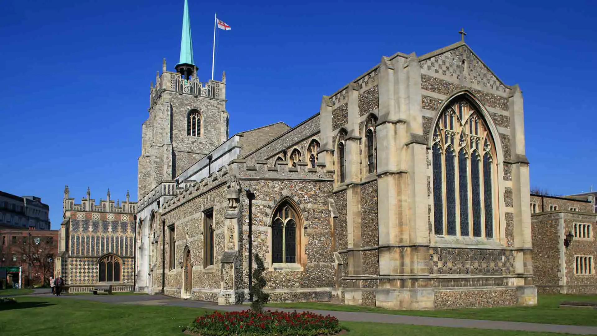 Stone church facade with arched windows